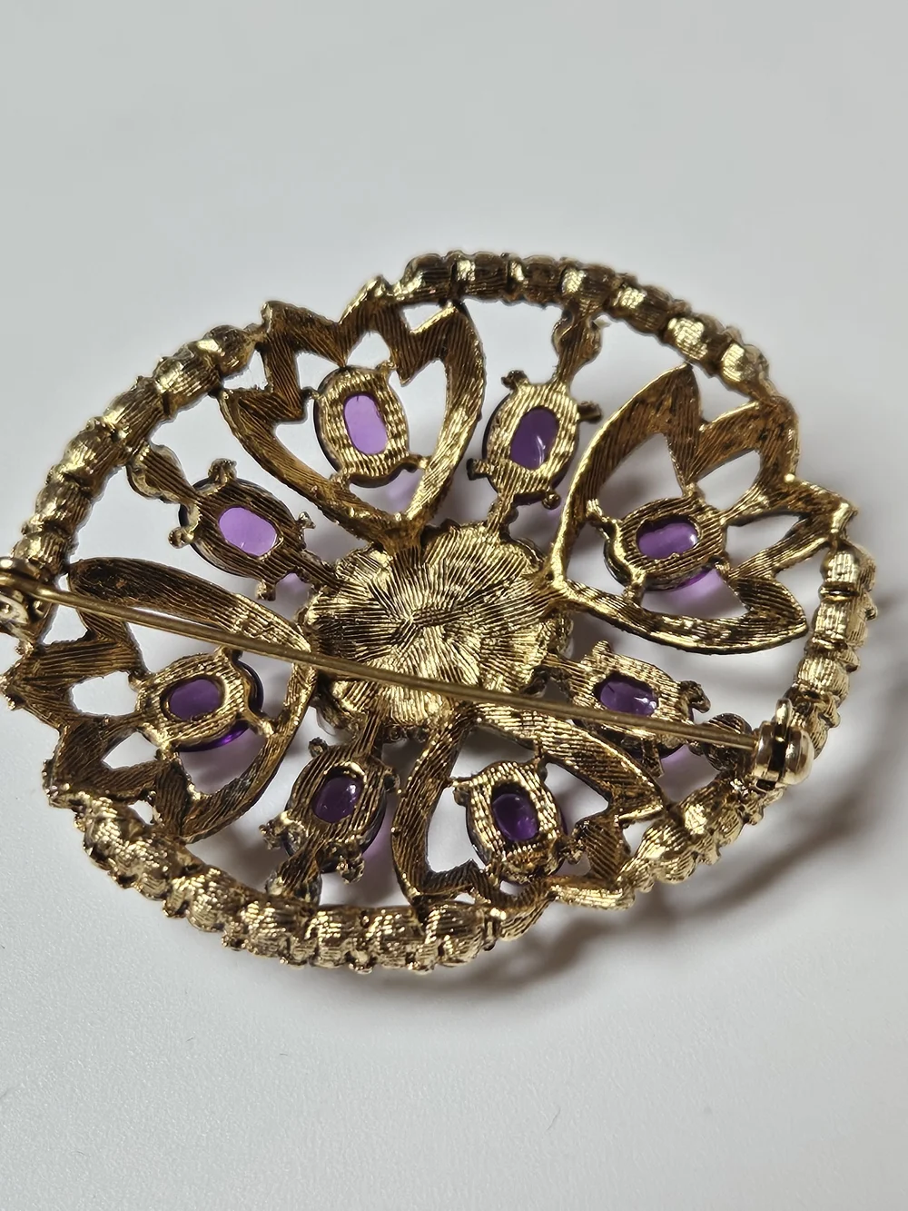 Gold-Tone Brooch with Purple Cabochons and Pearl Halo